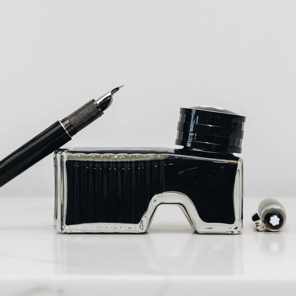 Assorted luxury fountain pens displayed on a clean white background