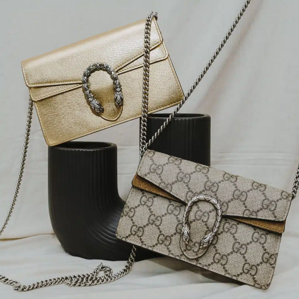 Luxury designer handbags collection displayed on a neutral background