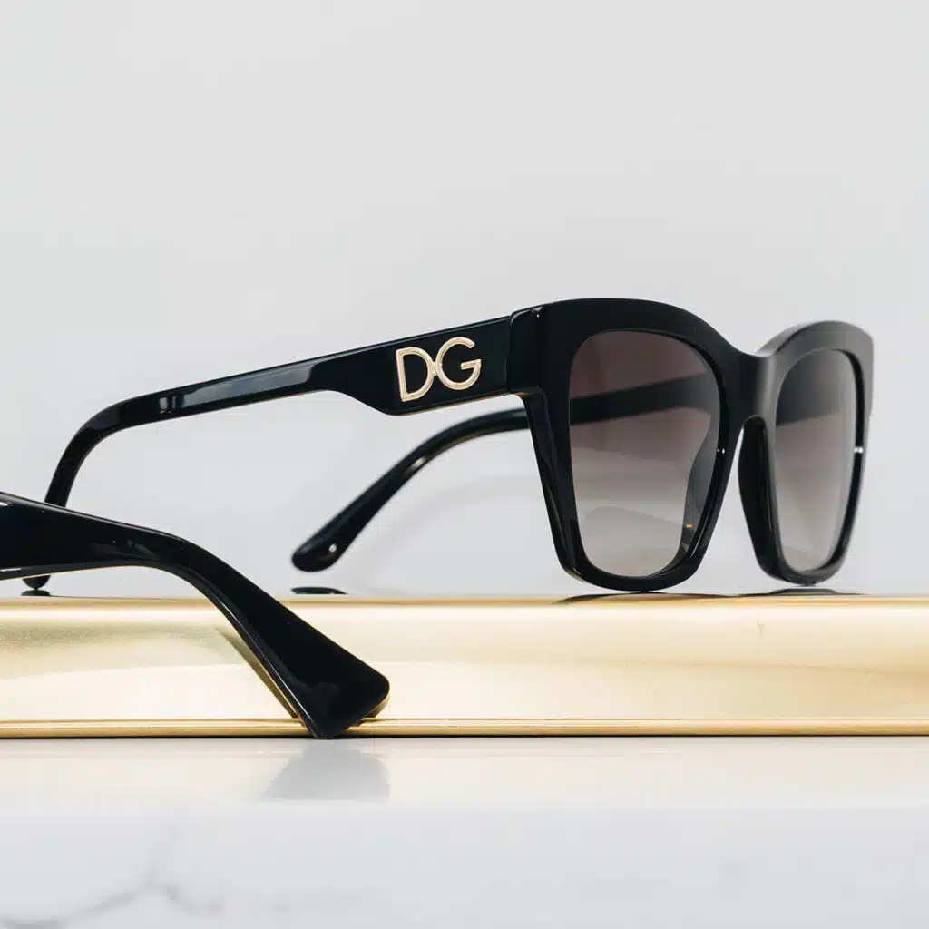 Assorted luxury fashion accessories neatly arranged on a neutral background