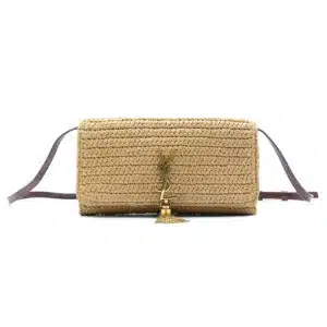 Woven tan crossbody bag with a tassel detail and dark brown strap.