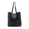 Black leather tote bag with two handles and a small hanging tag, shown on a white background.