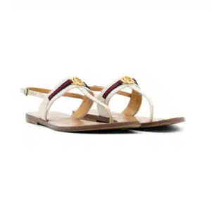 Luxury designer accessory with gold hardware on a white background